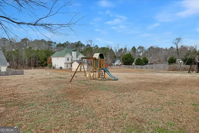 a childrens park with lots of swings and slides