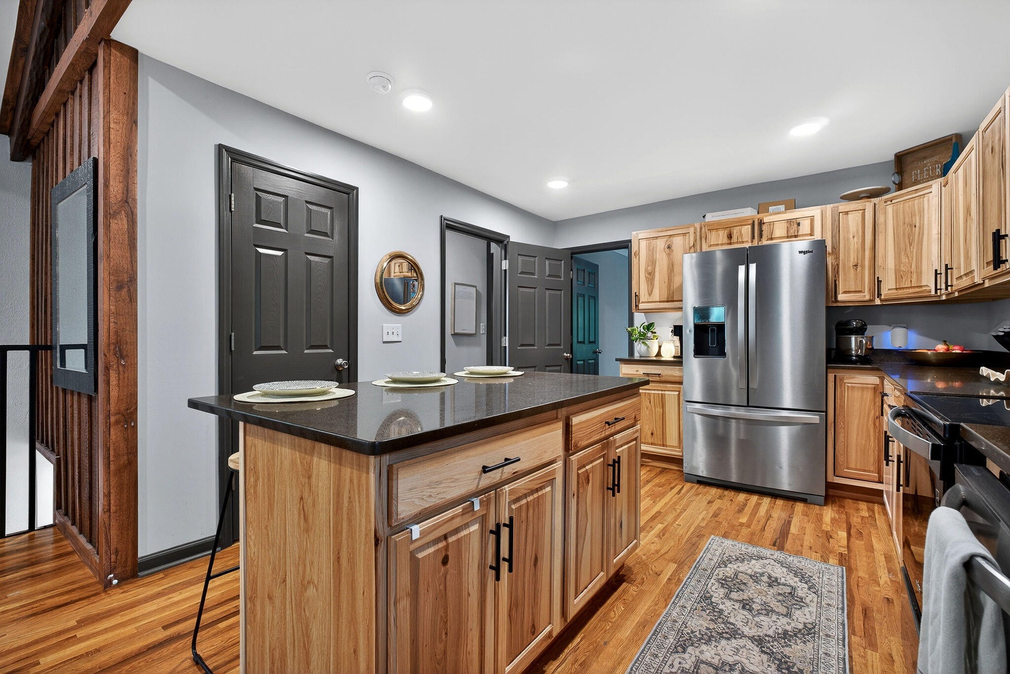 9388 Harrison Ferry Road McMinnville, TN 37110 - Photo 12 of 41 a kitchen with stainless steel appliances granite countertop a refrigerator and a stove top oven