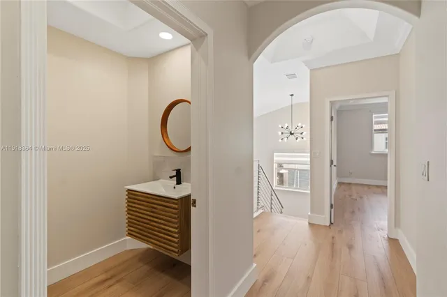 a bedroom with a bed and a mirror