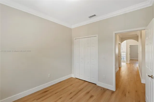 a view of a room with wooden floor