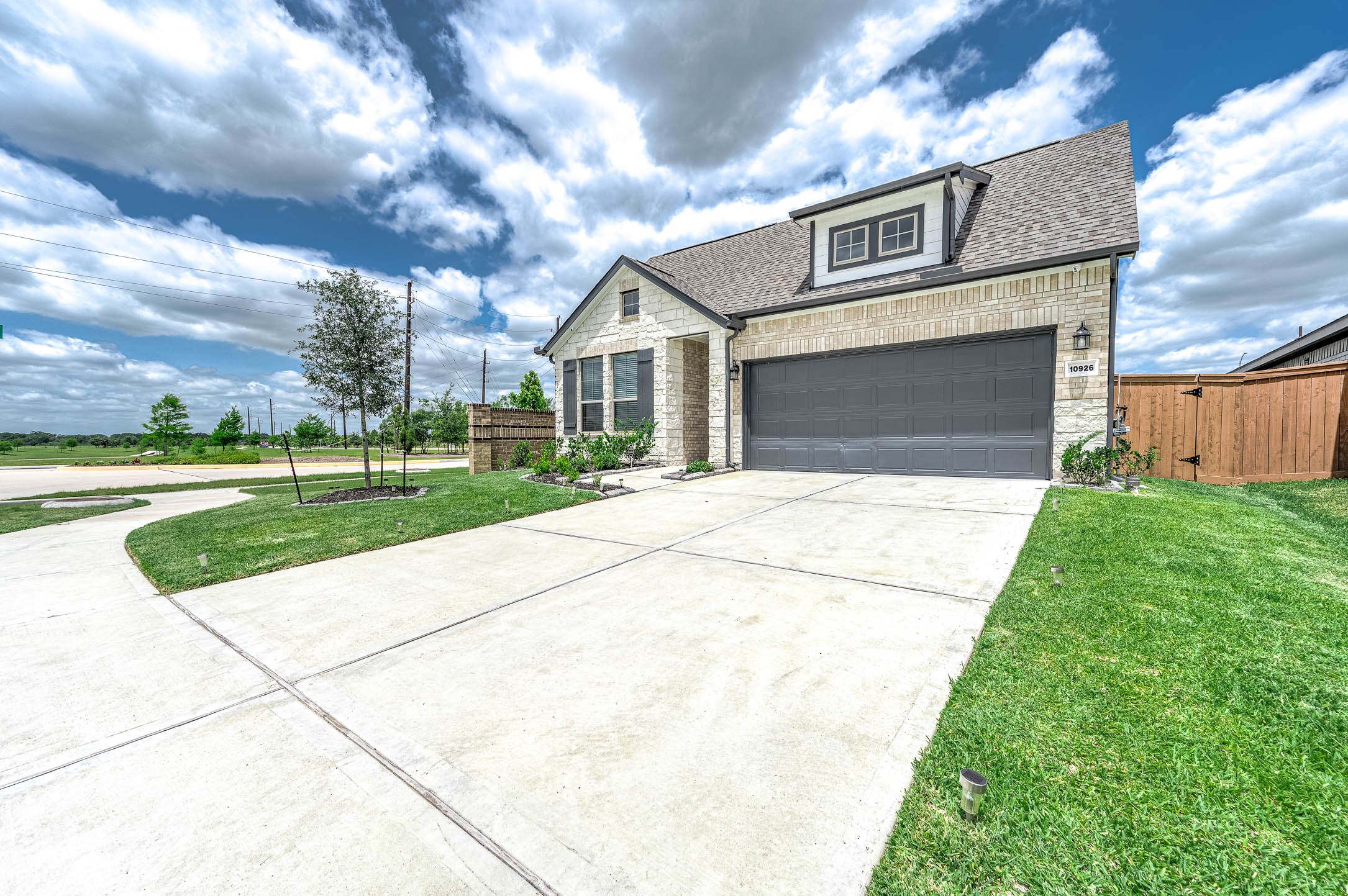 10926 Wander Way Beasley, TX 77417 - Photo 31 of 38 a front view of a house with a yard and garage