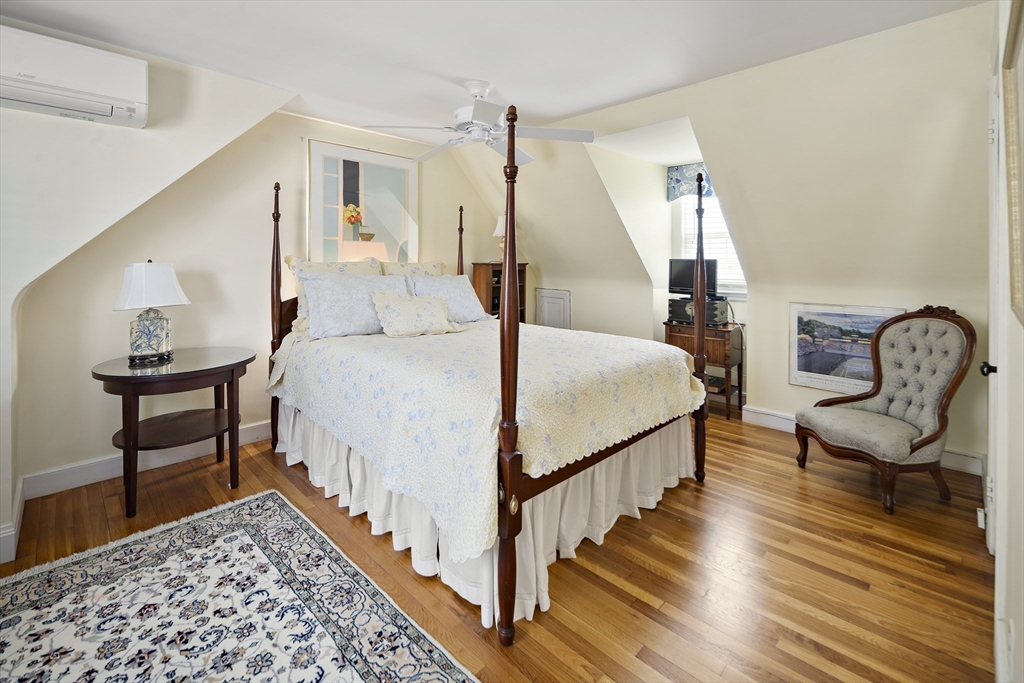 82 Risley Road Brookline, MA 02467 - Photo 14 of 20 a bedroom with bed and a table