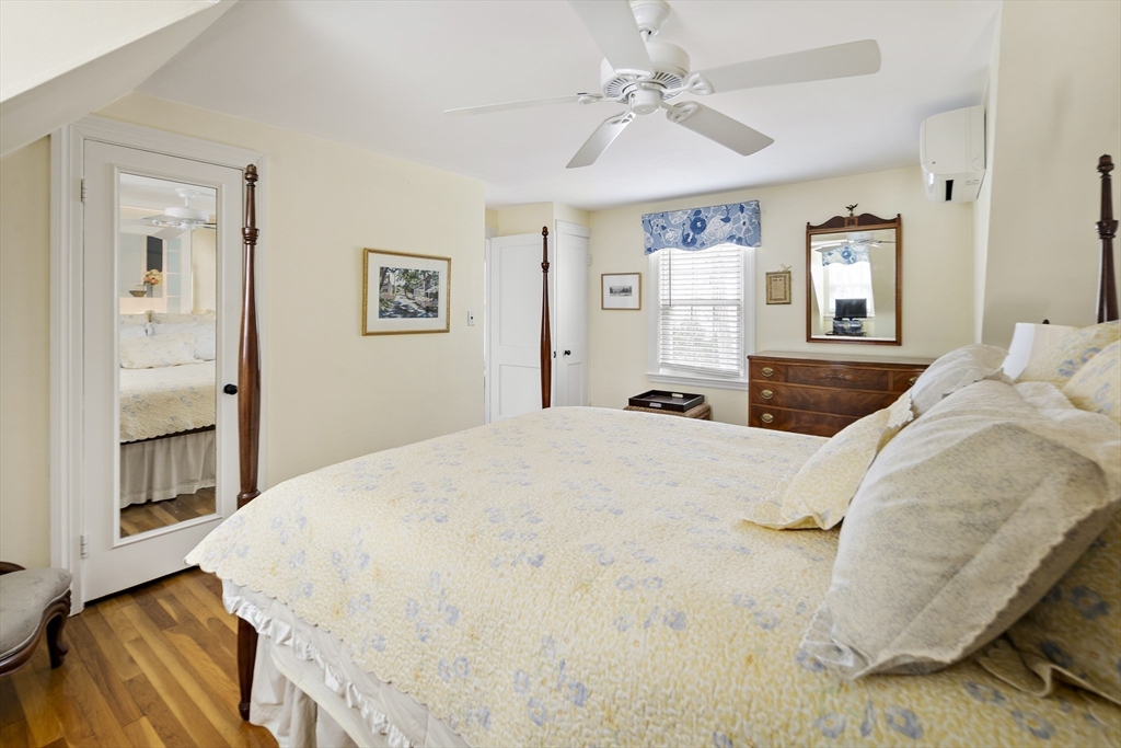 82 Risley Road Brookline, MA 02467 - Photo 15 of 20 a bedroom with a large bed and wooden floor