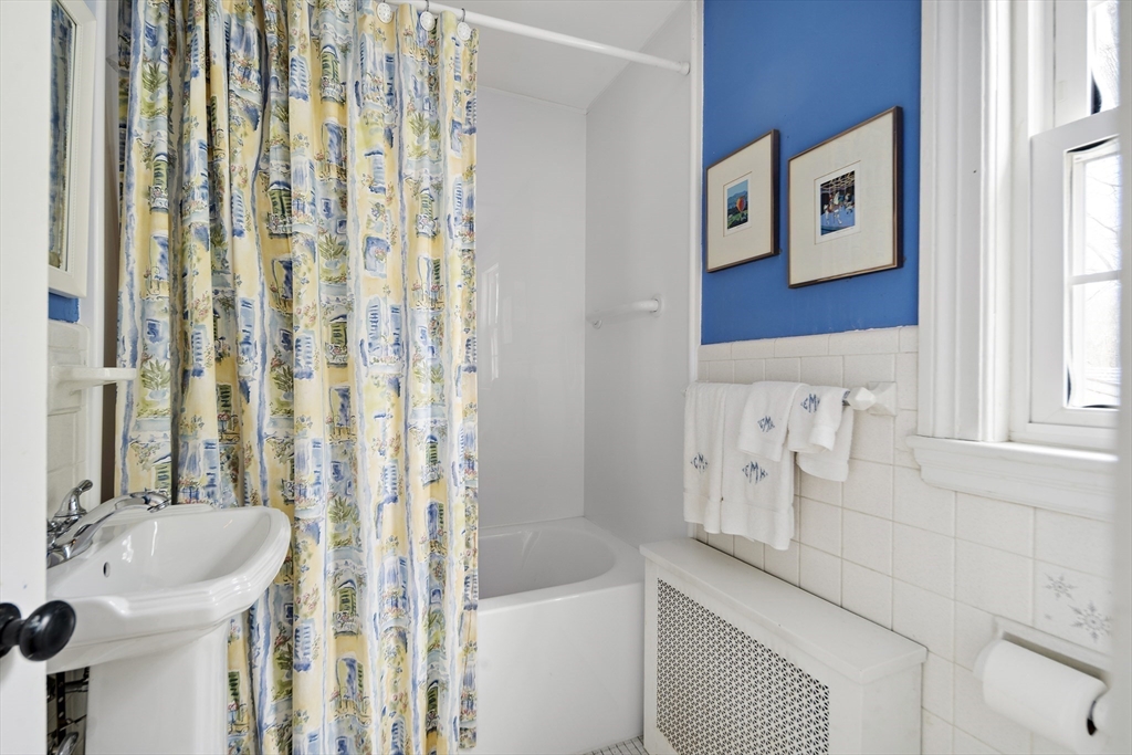 82 Risley Road Brookline, MA 02467 - Photo 17 of 20 a bathroom with a bathtub and a sink