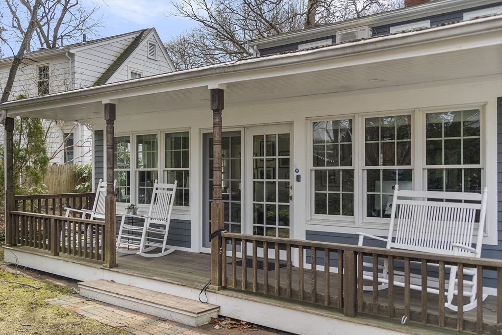82 Risley Road Brookline, MA 02467 - Photo 18 of 20 front view of a brick house with large windows