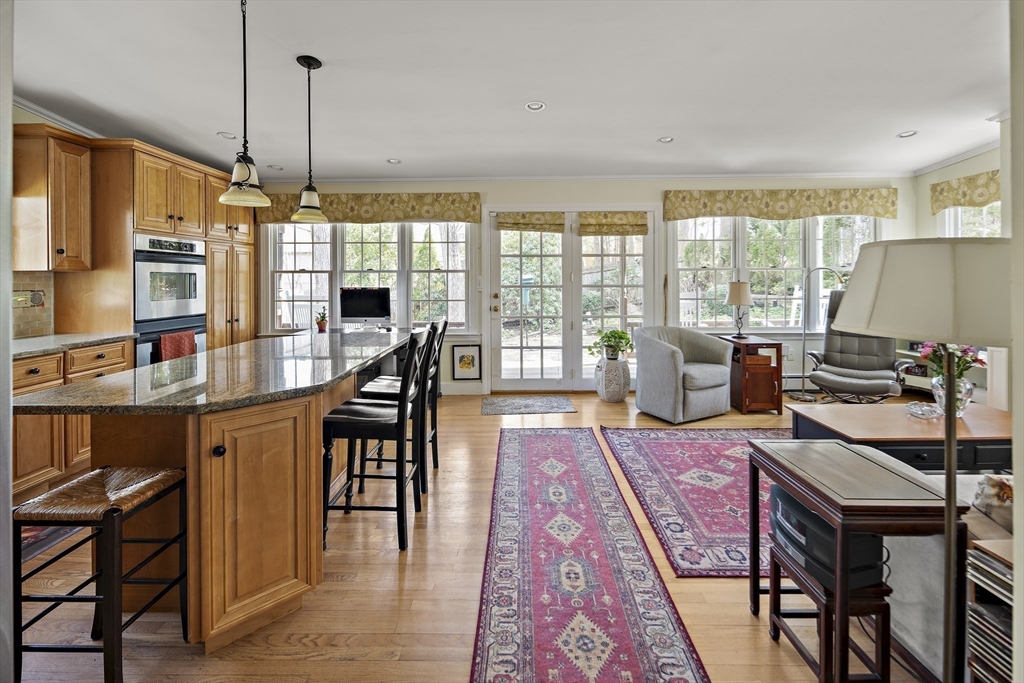 82 Risley Road Brookline, MA 02467 - Photo 3 of 20 a view of a dining room with furniture window and wooden floor