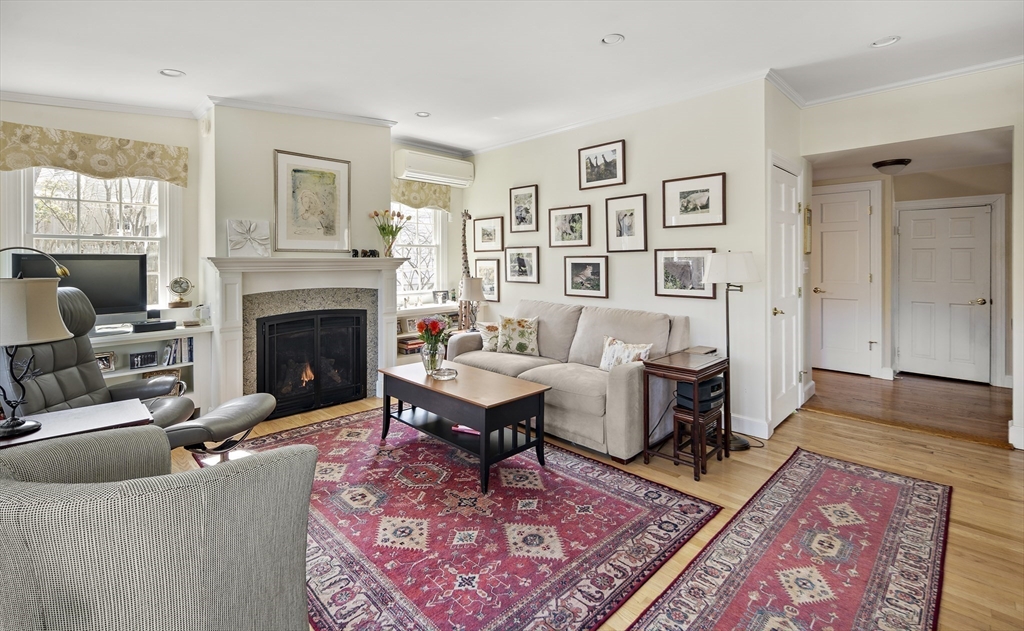 82 Risley Road Brookline, MA 02467 - Photo 5 of 20 a living room with furniture and a fireplace