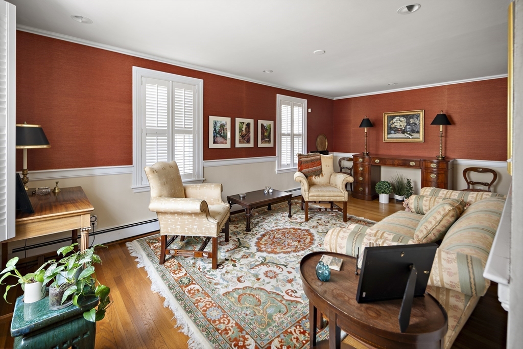 82 Risley Road Brookline, MA 02467 - Photo 8 of 20 a living room with furniture and a wooden floor