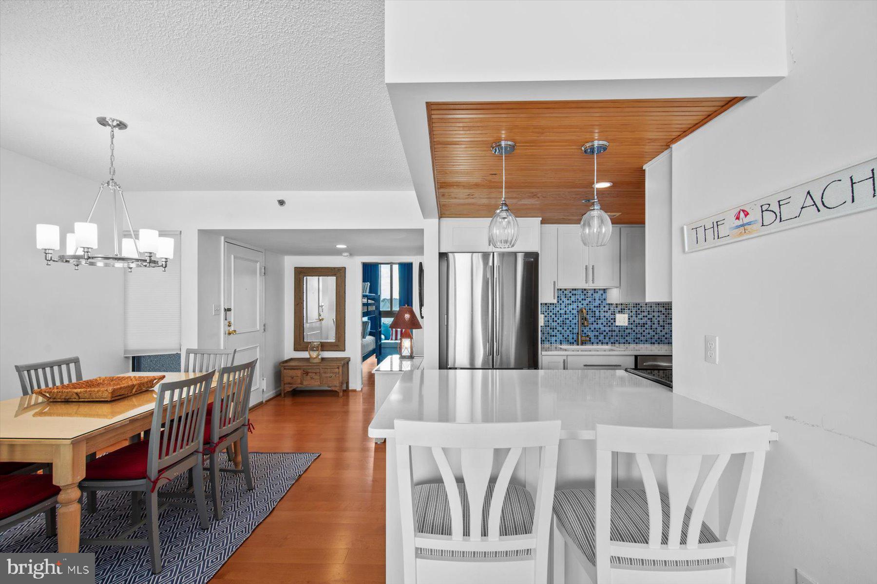 312 Island House Road Bethany Beach, DE 19930 - Photo 14 of 48 a outdoor dining space with furniture