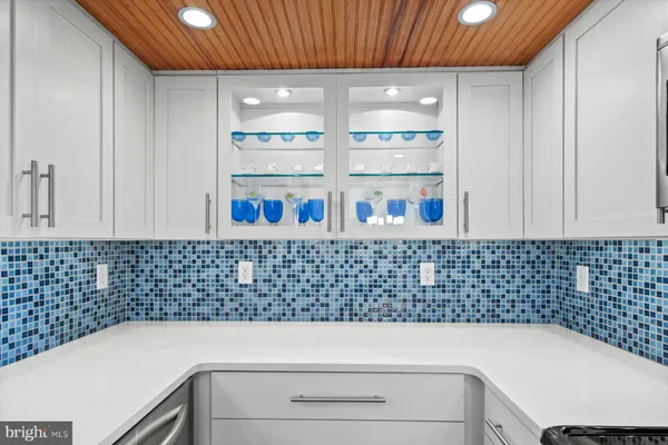 a bathroom with a sink a toilet and a shower