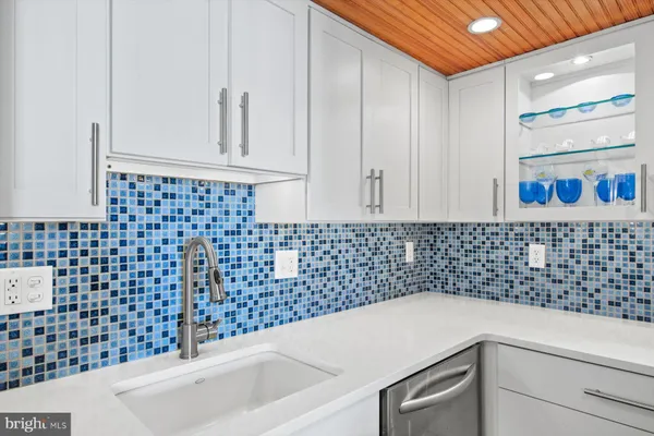 a kitchen with a stove microwave and sink