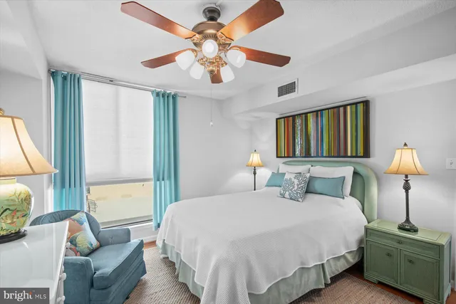 a bedroom with a large bed and a dresser