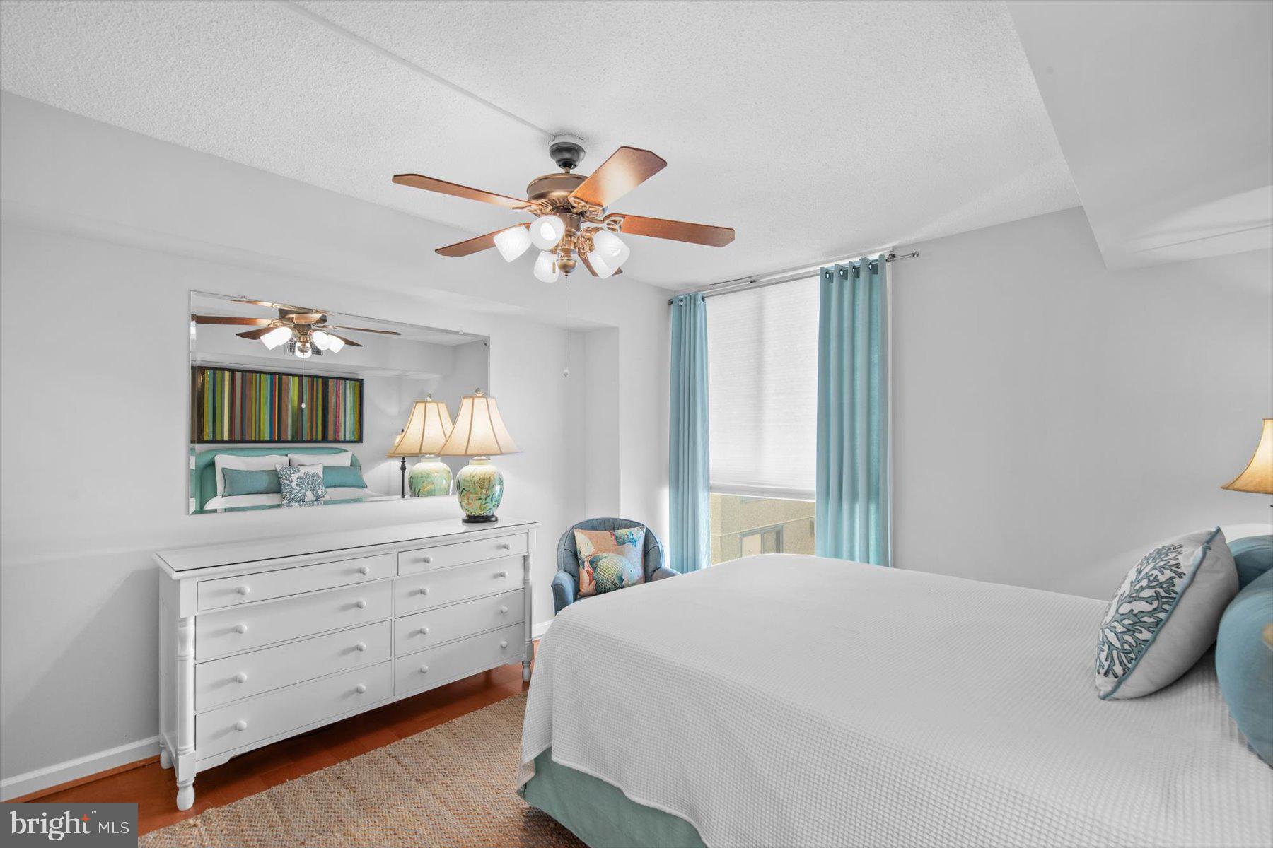 312 Island House Road Bethany Beach, DE 19930 - Photo 23 of 48 a bedroom with a large bed and a dresser