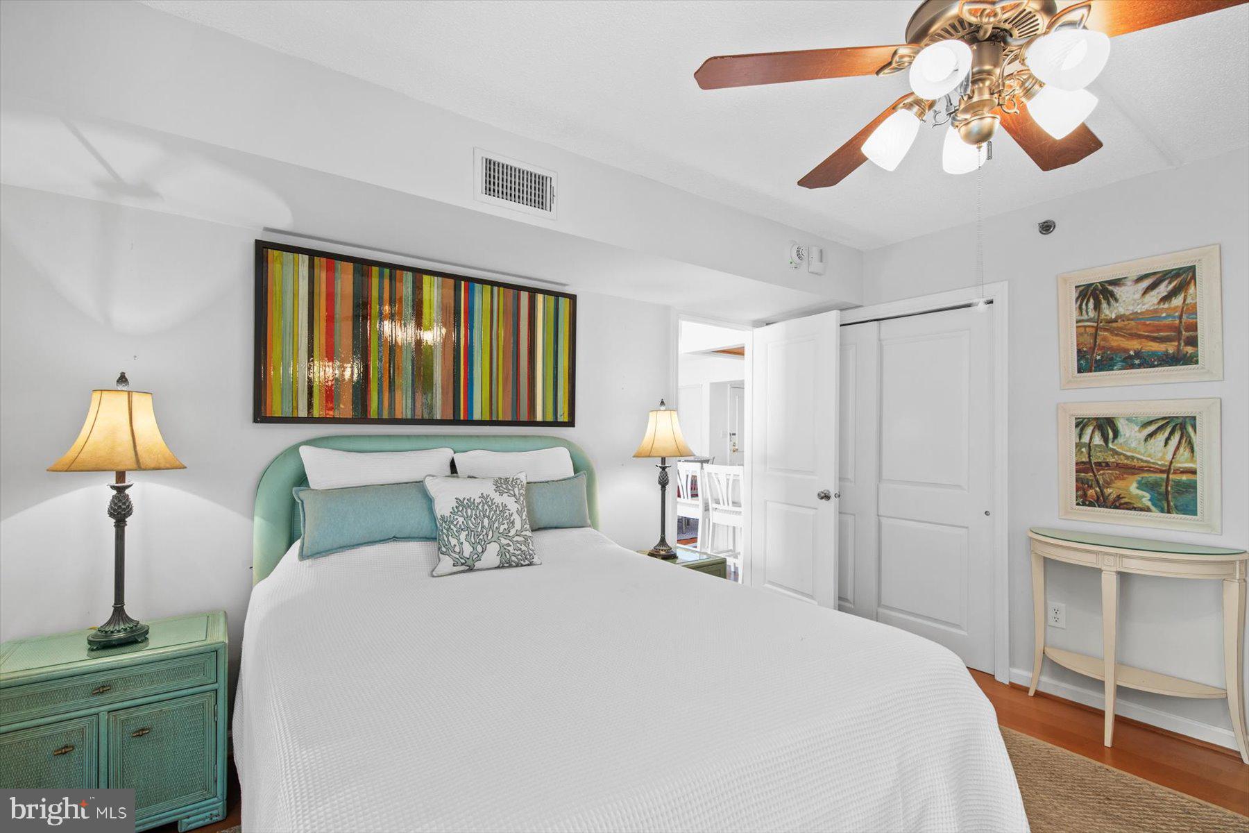 312 Island House Road Bethany Beach, DE 19930 - Photo 25 of 48 a bedroom with a bed and a chandelier