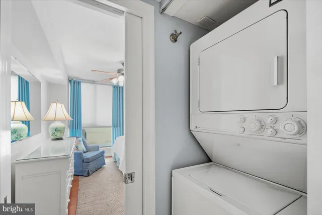 a bedroom with two beds and a window