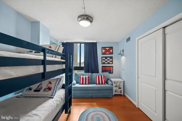 a living room with furniture and a book shelf