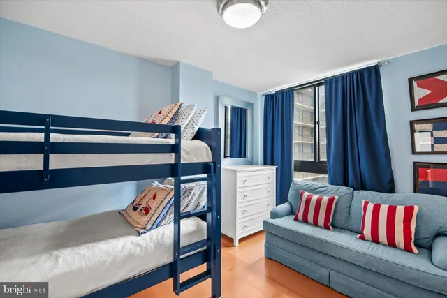 a bedroom with furniture and a dresser