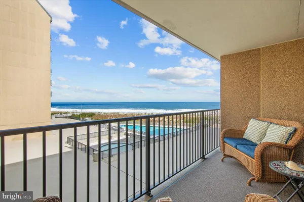 a view of a balcony with furniture