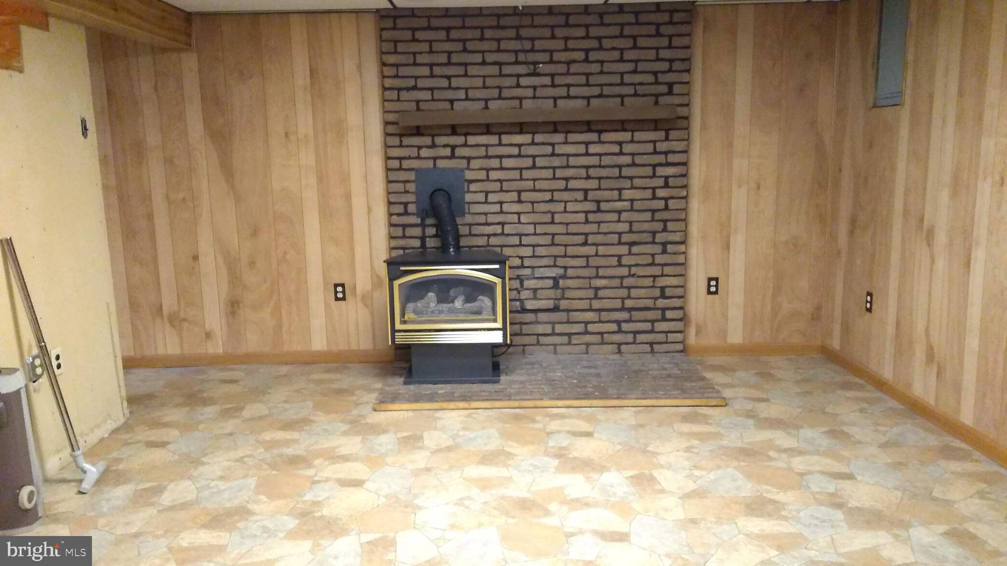 69 Slaymaker Hill Road Kinzers, PA 17535 - Photo 30 of 41 Finished Basement with Propane Stove