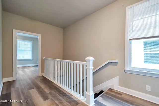 a view of entryway with wooden floor