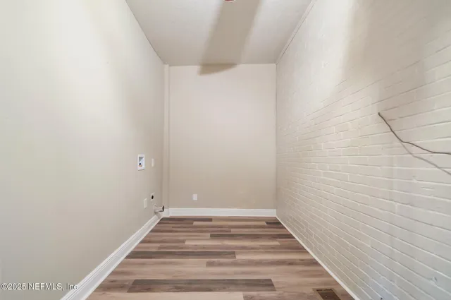 a view of small space with wooden floor