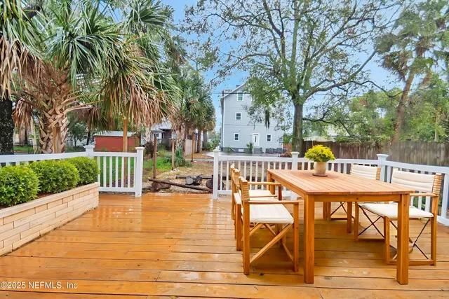 a view of a swimming pool with a patio and a yard