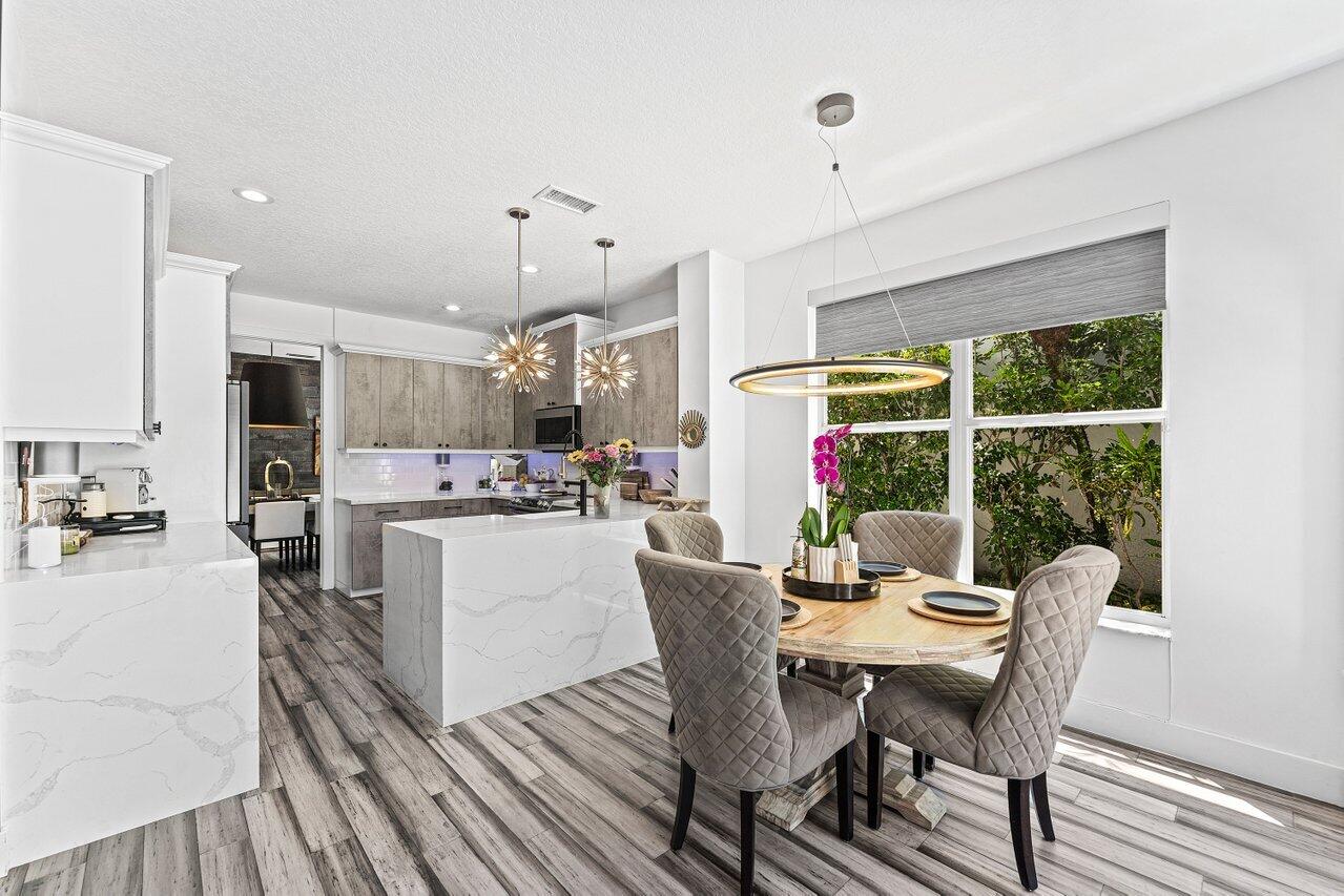 3395 Northwest 53rd Circle Boca Raton, FL 33496 - Photo 8 of 64 a view of a dining room with furniture window and outside view