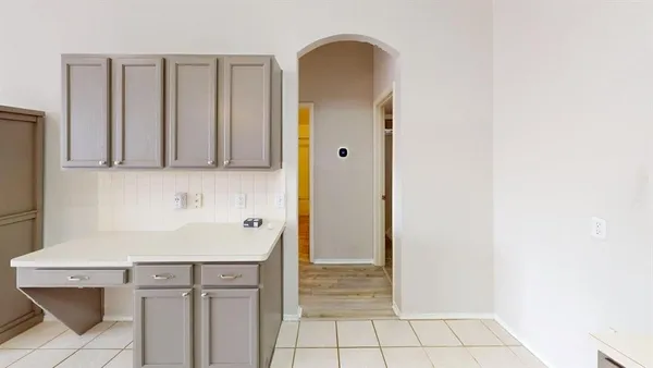 a view of an empty room with a fireplace