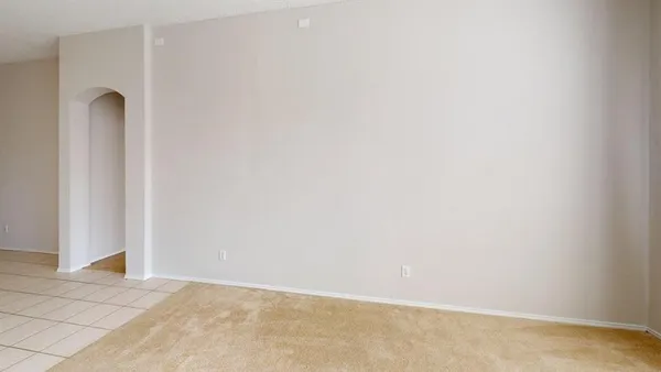 wooden floor in an empty room and a window