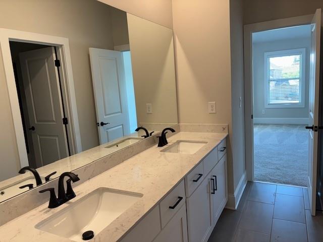 4015 Sierra Vista Circle Cumming, GA 30040 - Photo 22 of 29 a bathroom with a tub sink and mirror