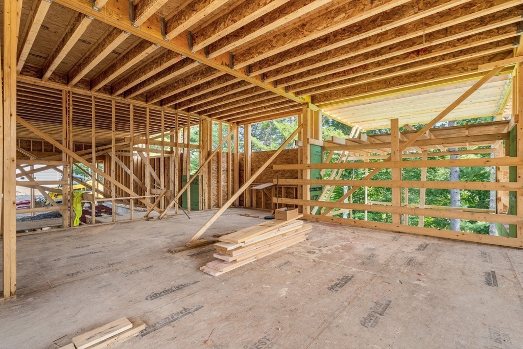 25 Holly Way Canton, MA 02021 - Photo 18 of 25 a view of an empty room with wooden floor and windows
