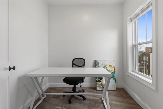 a view of a workspace with furniture