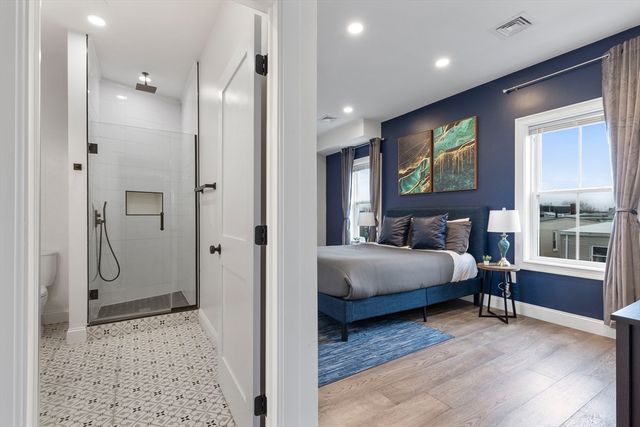 a bedroom with a bed and a view of bathroom