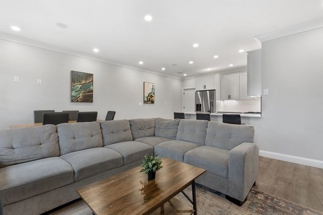 a living room with furniture and a couch