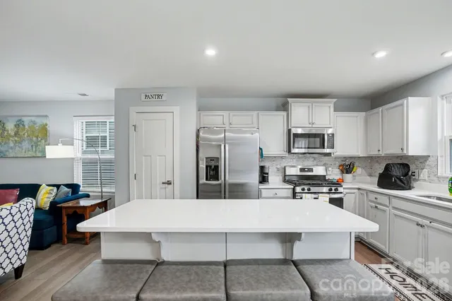 a bedroom with a bed and a chair