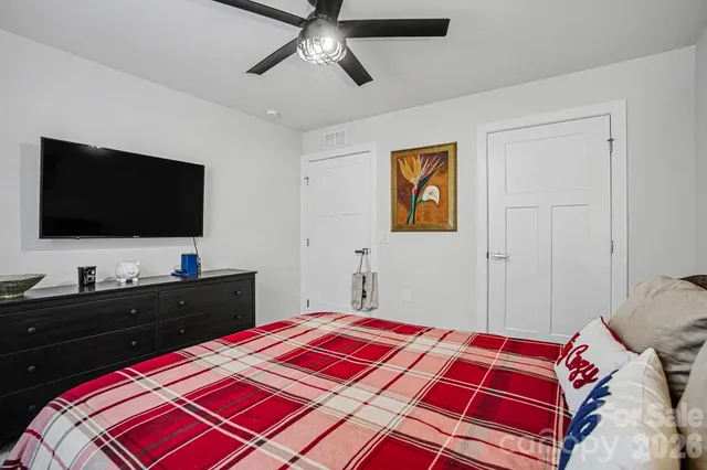 a view of a livingroom with furniture and a flat screen tv