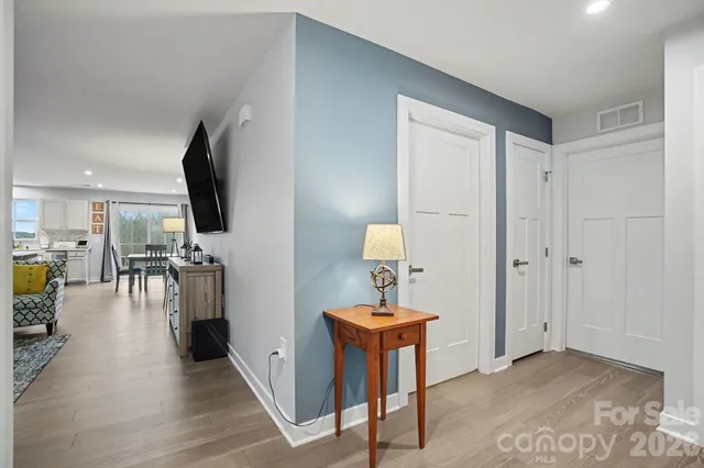 a bedroom with a bed and a chair