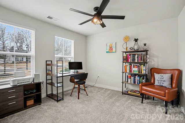 a reading room with furniture and a window