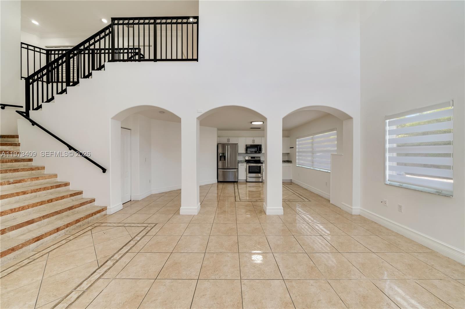 13050 Southwest 26th Street Miami, FL 33175 - Photo 6 of 43 a view of an entryway with wooden floor