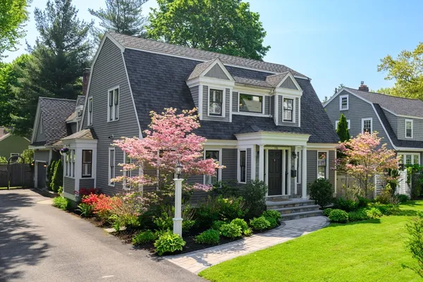 a front view of a house with garden