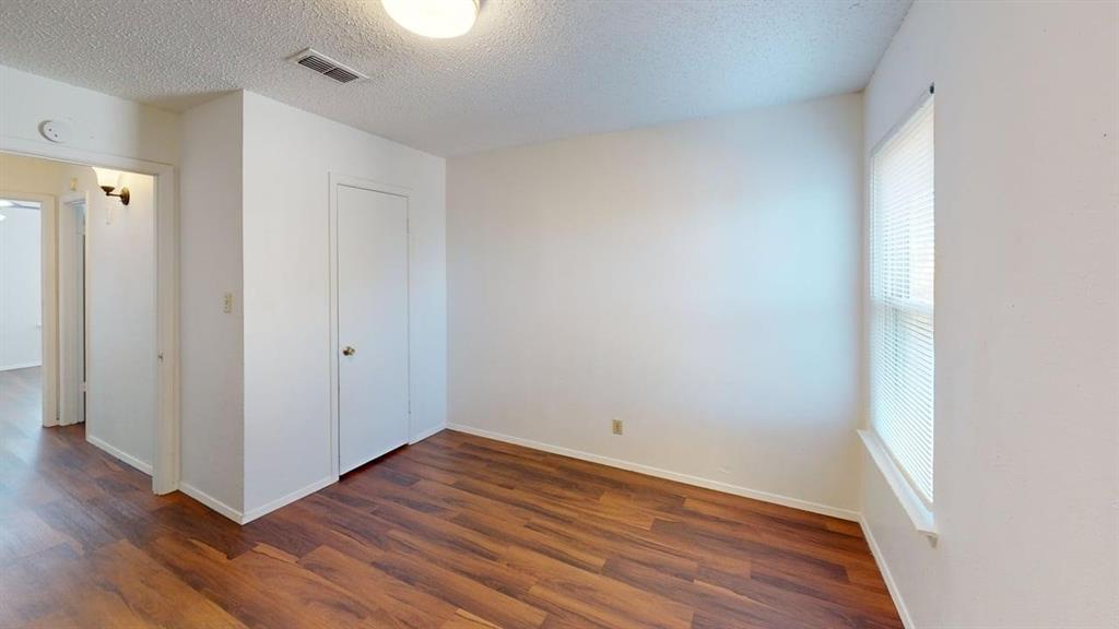 410 Bryan Street, Unit 10 Denton, TX 76201 - Photo 8 of 10 a view of a room with wooden floor