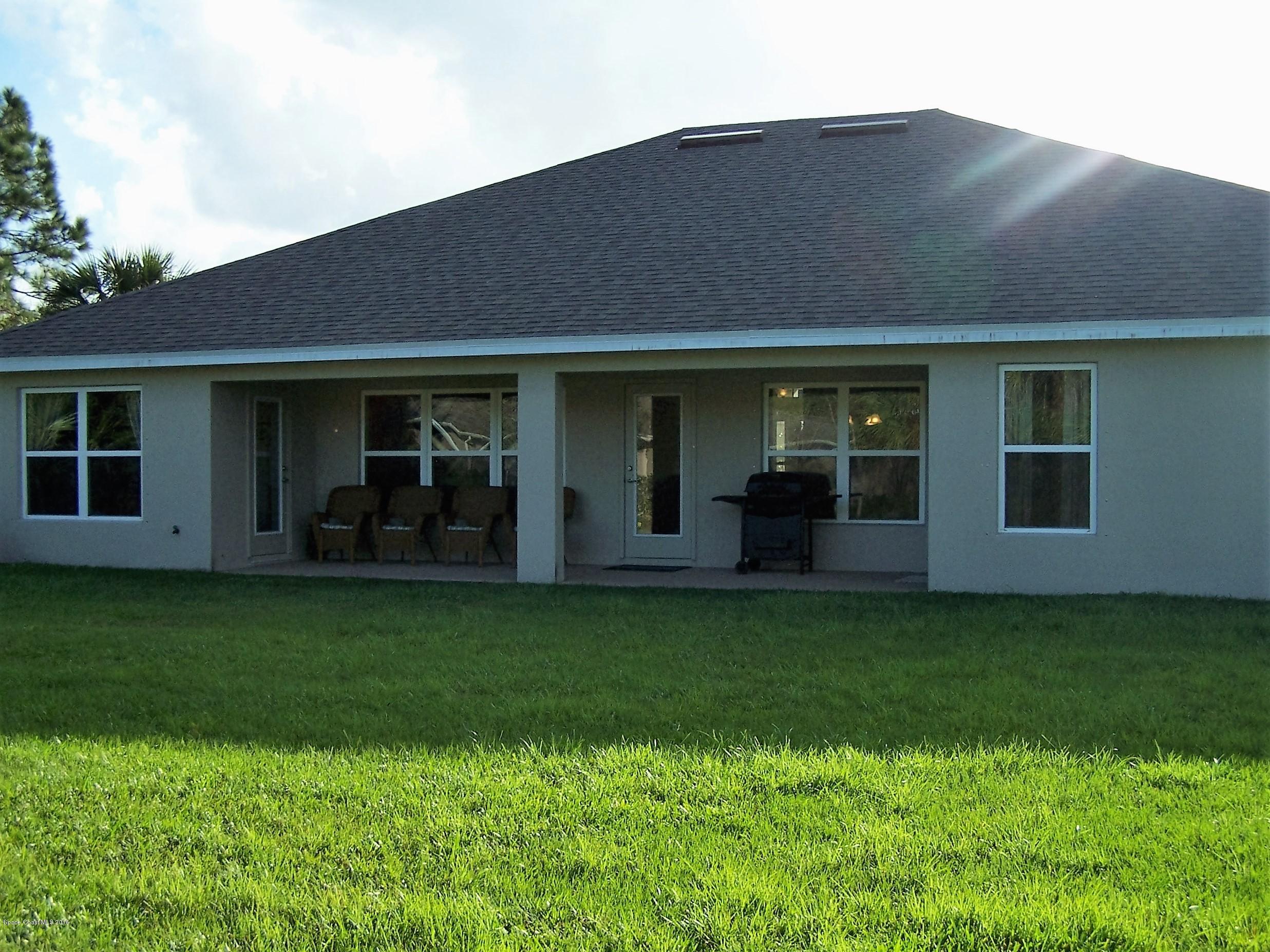 800 Kecherburg Road Southwest Palm Bay, FL 32908 - Photo 12 of 12 Covered Lanai Sample Picture