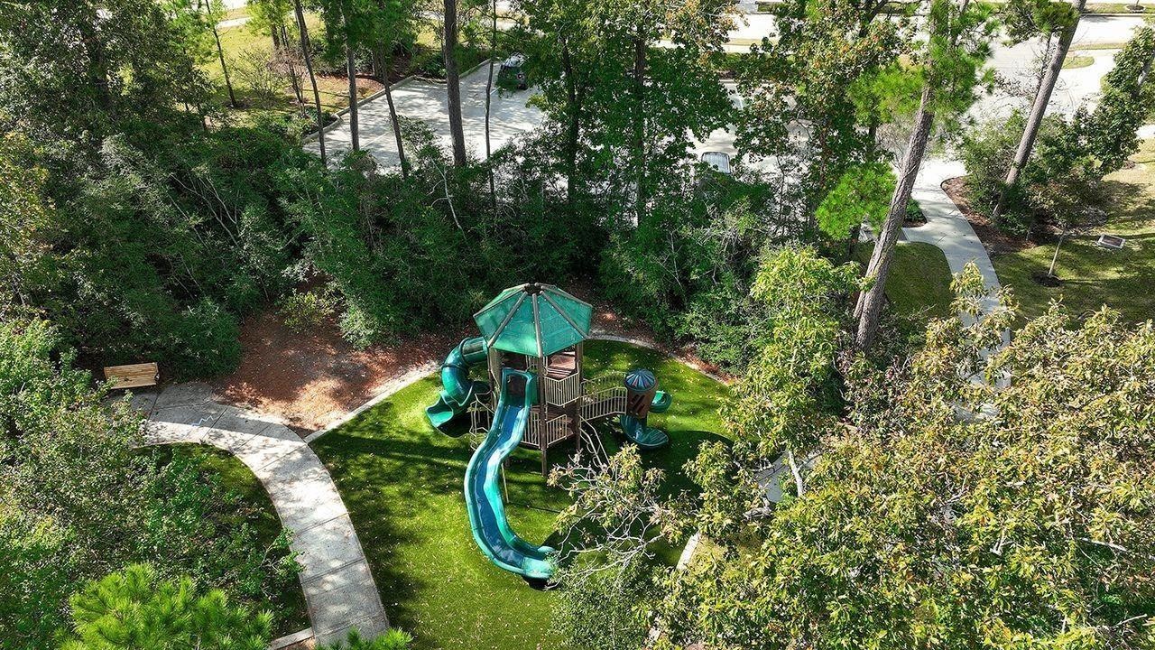 330 Mill Creek Road Pinehurst, TX 77362 - Photo 34 of 36 an aerial view of a house with a yard and trees