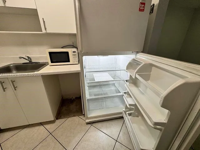 a couple of cars parked on road view from a balcony
