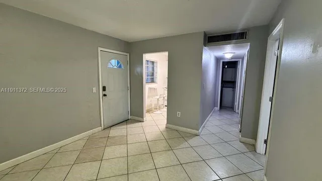 a view of an empty room and window