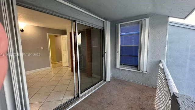 a view of empty room with a door