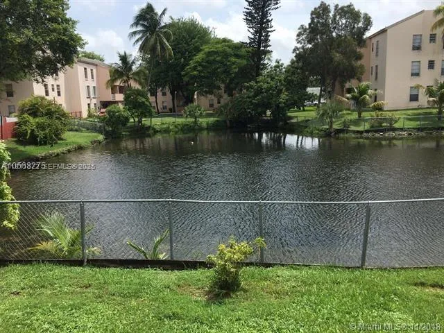 a view of a lake with a yard