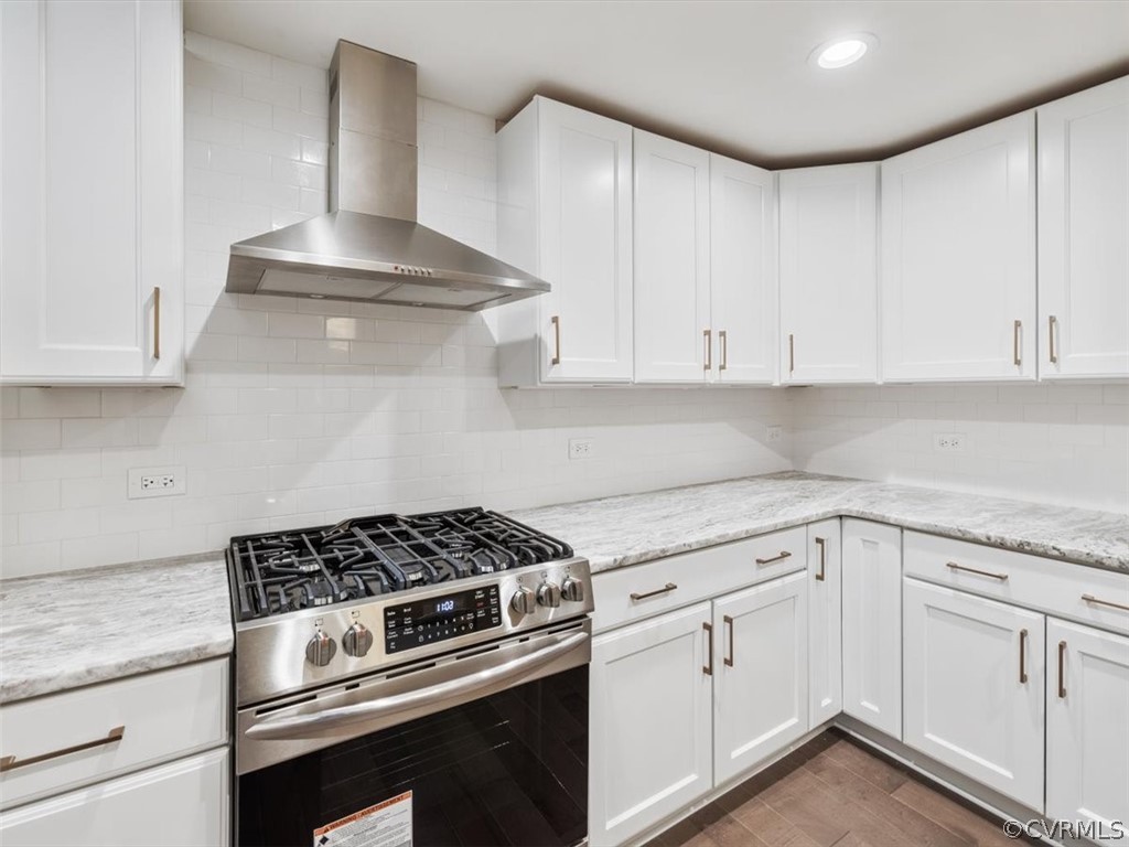 413 Stuart Circle, Unit UPLC Richmond, VA 23220 - Photo 11 of 36 a kitchen with white cabinets and appliances