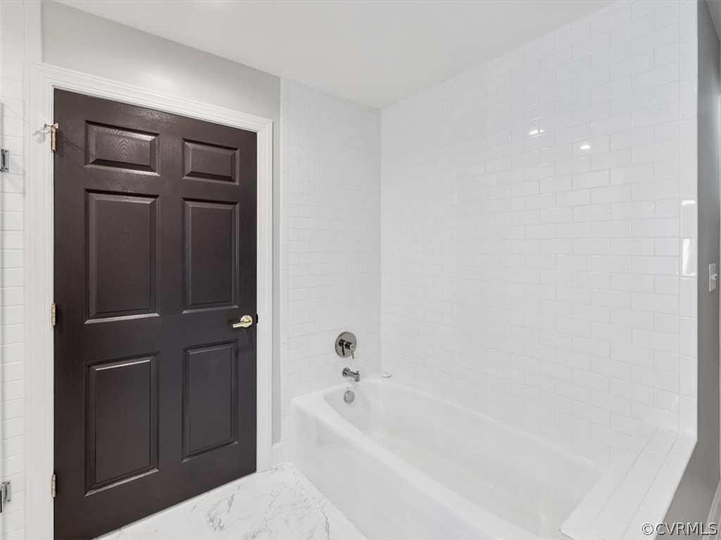 413 Stuart Circle, Unit UPLC Richmond, VA 23220 - Photo 16 of 36 a bathroom with a bathtub and a shower