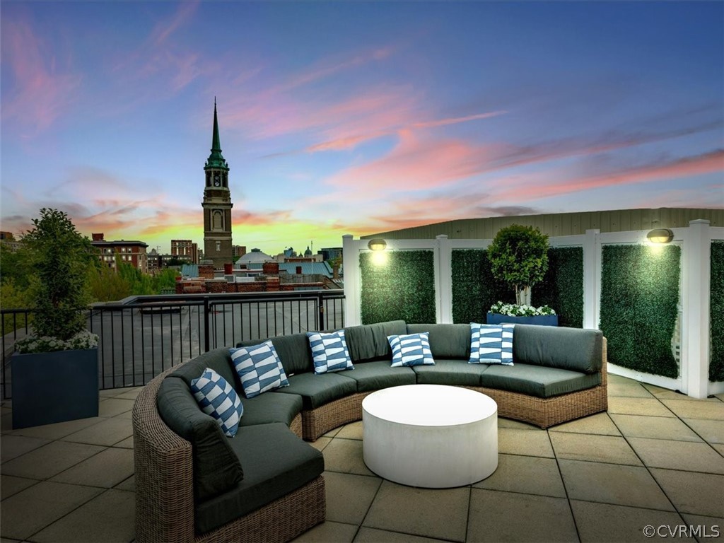 413 Stuart Circle, Unit UPLC Richmond, VA 23220 - Photo 23 of 36 a view of a roof deck with couches and potted plants